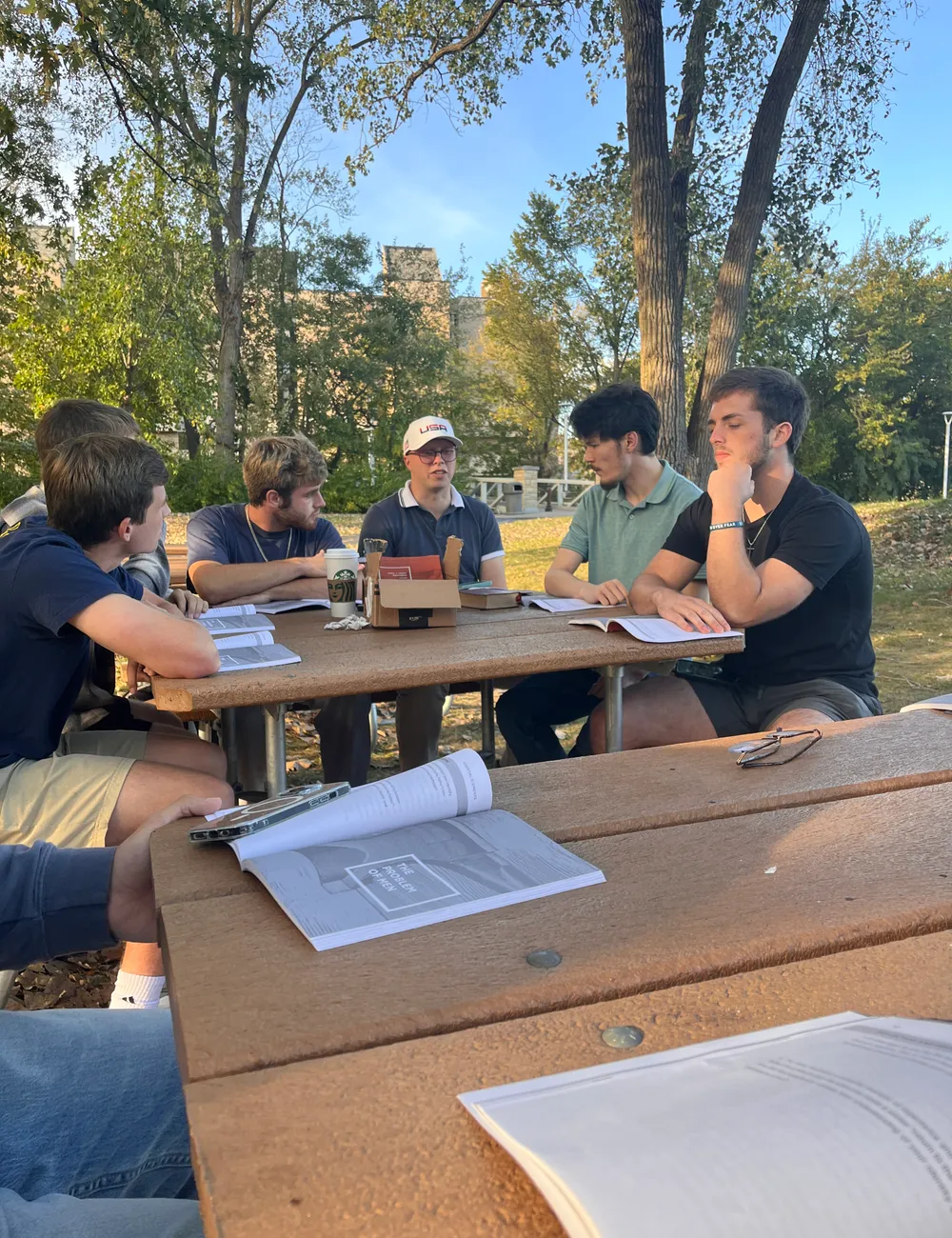 Campus Forge men studying together outdoors on campus