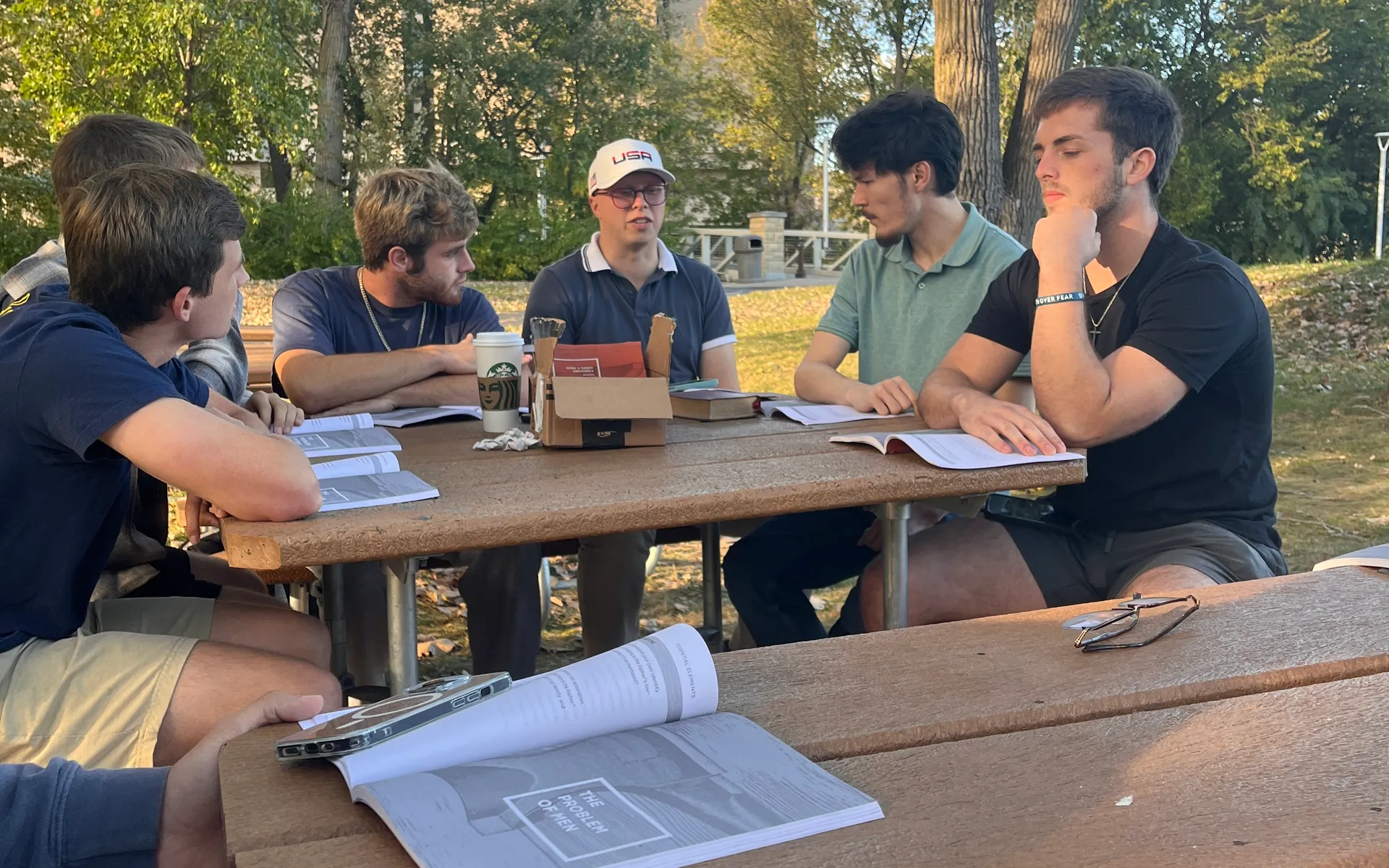 Campus Forge men studying together outdoors on campus